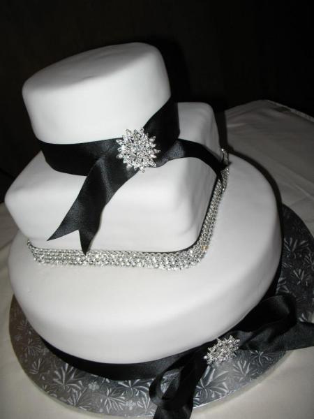 This cake was decorated with rhinestones and ribbon to match the wedding colors.    