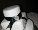 This cake was decorated with rhinestones and ribbon to match the wedding colors.    